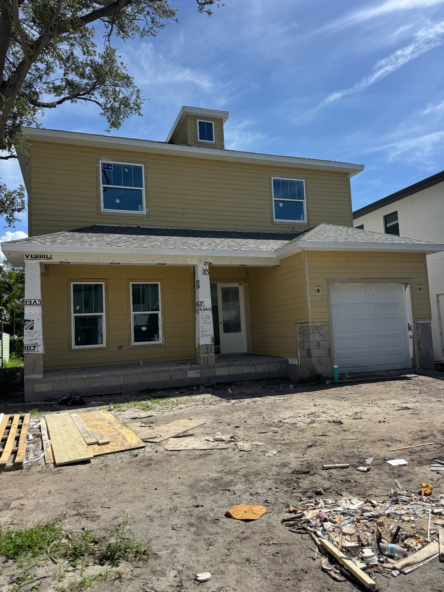 Two-story home prepped for stucco columns and stone accents