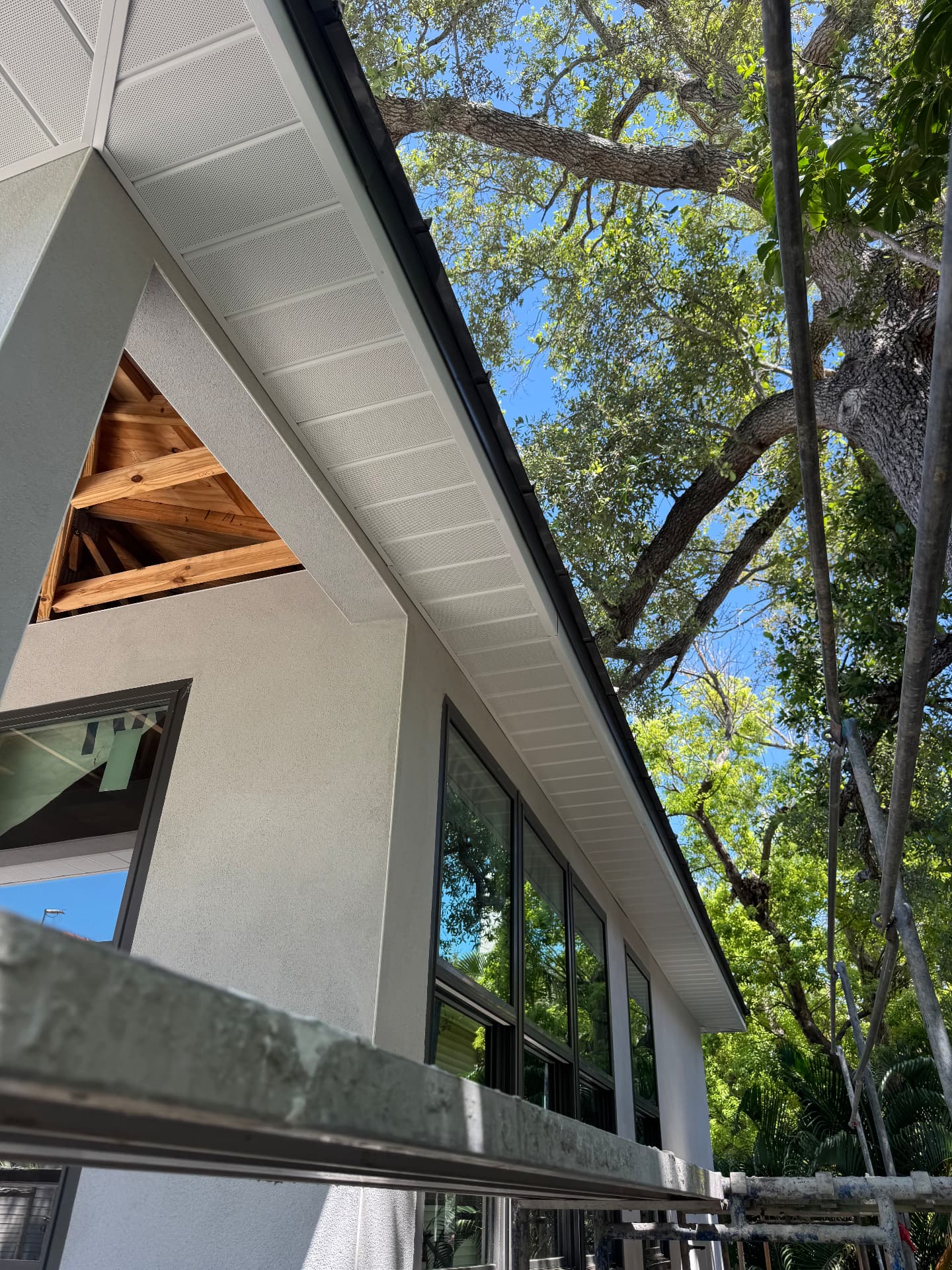 Clean stucco eave and soffit detail on a modern custom home